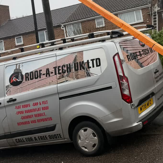 The Roof-A-Tech UK Ltd van parked on site showing its services and contact details